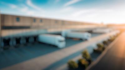 Background: trucks aan dock van warehouse
